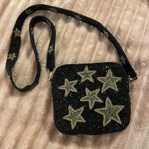 New. Black Star Beaded Purse. Strap is 48inch purse is 8x8never been used.